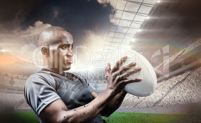 Composite image of rugby player looking away while throwing ball