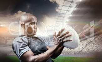 Composite image of rugby player looking away while throwing ball