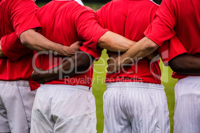 Rugby players standing together before match