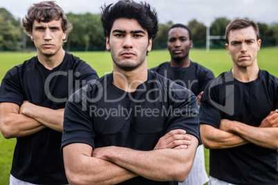 Rugby players scowling at camera