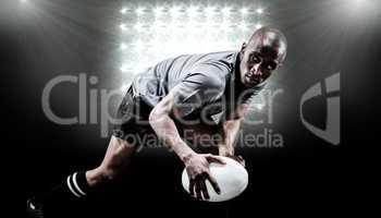 Composite image of determined sportsman looking away while playi
