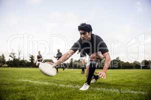 Rugby players training on pitch