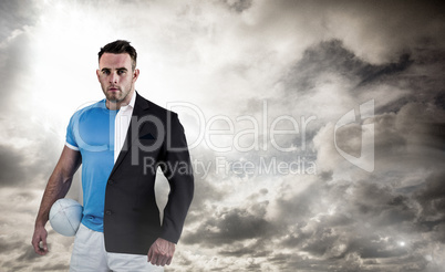 Composite image of rugby player looking at camera
