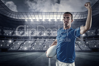 Composite image of confident rugby player flexing muscles