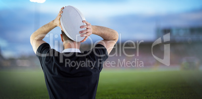 Composite image of rugby player running with the rugby ball