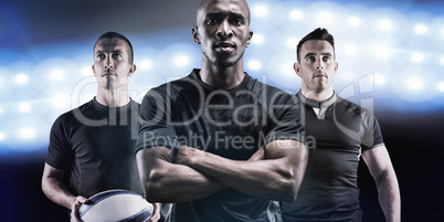 Composite image of portrait of confident rugby player with arms