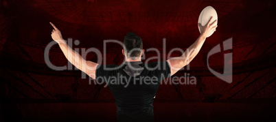 Composite image of rugby player celebrating with the ball