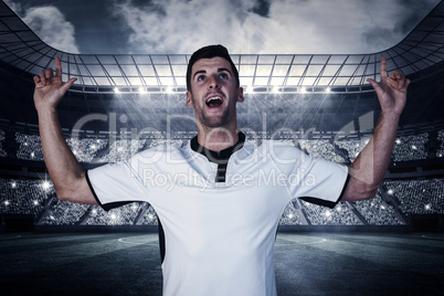 Composite image of surprised rugby player pointing up