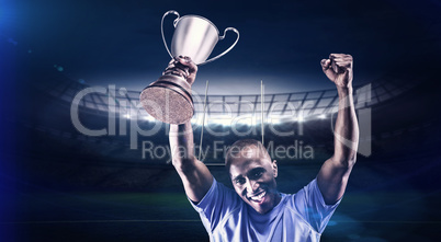 Composite image of portrait of happy sportsman cheering while ho