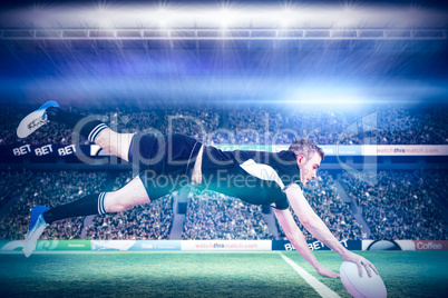 Composite image of a rugby player scoring a try