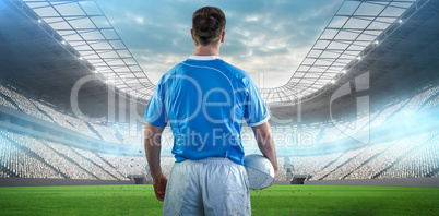 Composite image of rugby player holding a rugby ball Composite image of rugby player holding a rugby ball