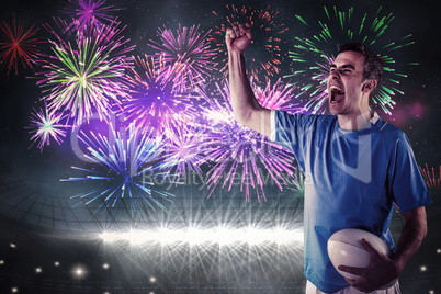 Composite image of a rugby player gesturing victory