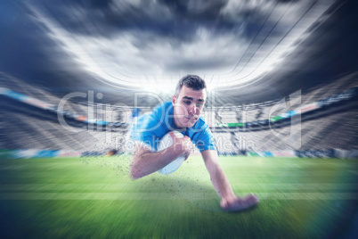 Composite image of a rugby player scoring a try