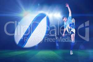 Composite image of rugby player kicking