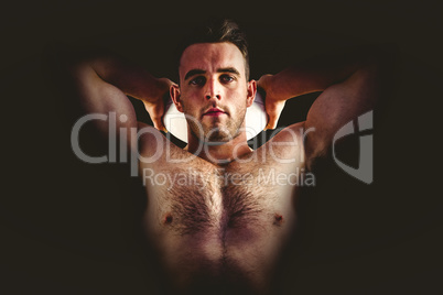 Shirtless rugby player holding ball Shirtless rugby player holding ball