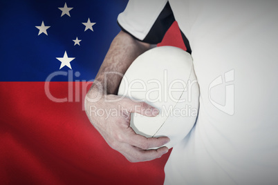 Composite image of midsection of player holding rugby ball
