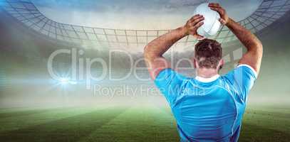 Composite image of rugby player throwing the ball