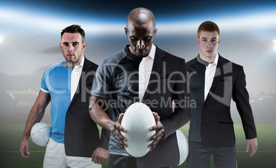 Composite image of rugby player holding a rugby ball