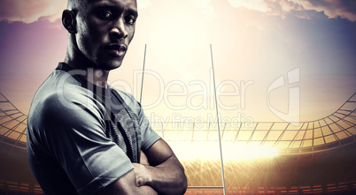 Composite image of portrait of confident athlete with arms cross