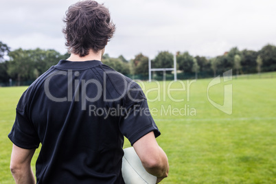 Rugby player looking at posts
