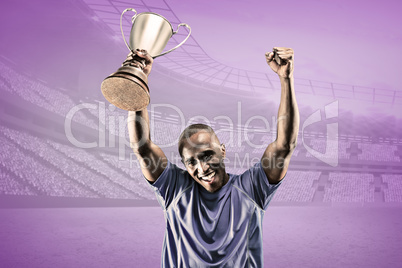 Composite image of portrait of happy sportsman cheering while ho