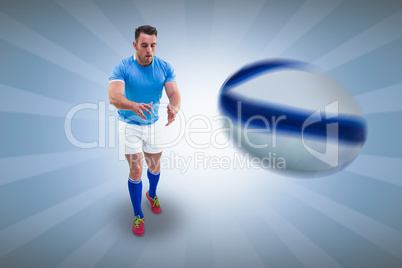 Composite image of rugby player ready to catch