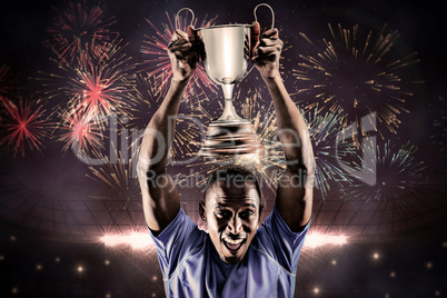 Composite image of portrait of happy athlete cheering while hold