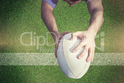 Composite image of rugby player ready to tackle the opponent