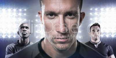 Composite image of close-up portrait of serious rugby player