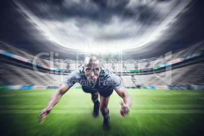 Composite image of portrait of rugby player jumping