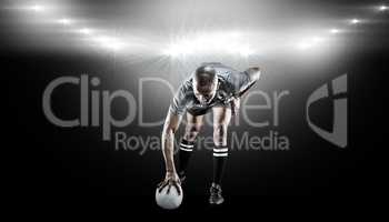 Composite image of rugby player taking position