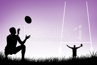 Composite image of full length of rugby player catching the ball