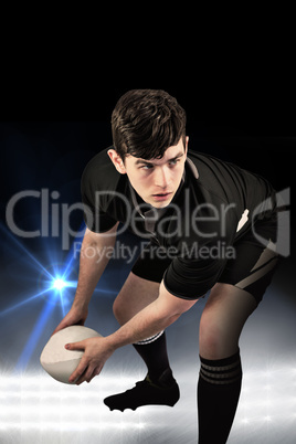 Composite image of rugby player about to throw the rugby ball