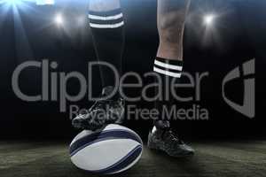 Composite image of rugby player in black socks on ball