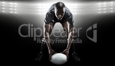 Composite image of portrait of sportsman holding ball while play