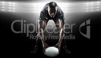 Composite image of portrait of sportsman holding ball while play