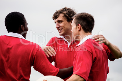 Rugby players celebrating a win