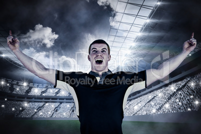 Composite image of a rugby player gesturing victory