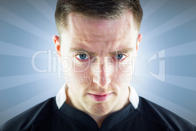 Composite image of a rugby player looking down