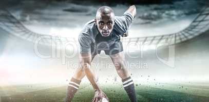 Composite image of portrait of sportsman playing rugby