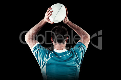 Composite image of rugby player about to throw a rugby ball