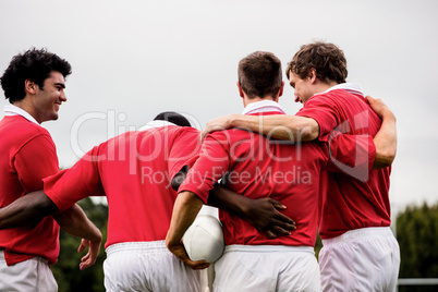 Rugby players celebrating a win