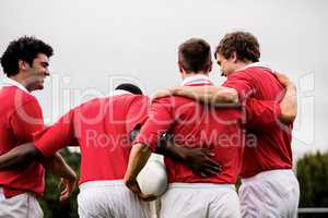 Rugby players celebrating a win