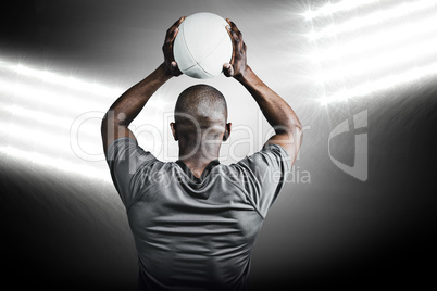 Composite image of rear view of athlete throwing rugby ball