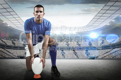 Composite image of full length portrait of rugby player placing