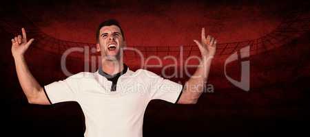 Composite image of excited rugby player pointing up