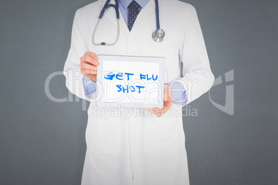 Composite image of doctor showing digital tablet on white backgr