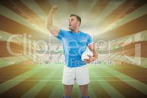 Composite image of rugby player cheering with the ball