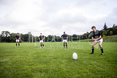Rugby players training on pitch