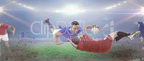 Composite image of a rugby player scoring a try